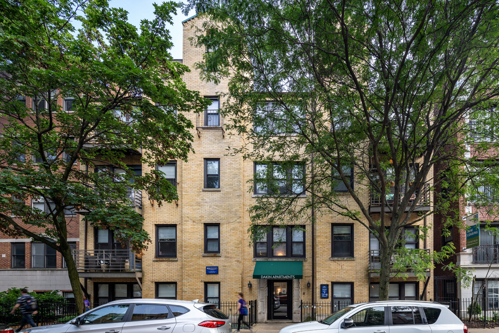A yellow brick apartment building at 917 West Dakin in Chicago’s Wrigleyville neighborhood. The b...