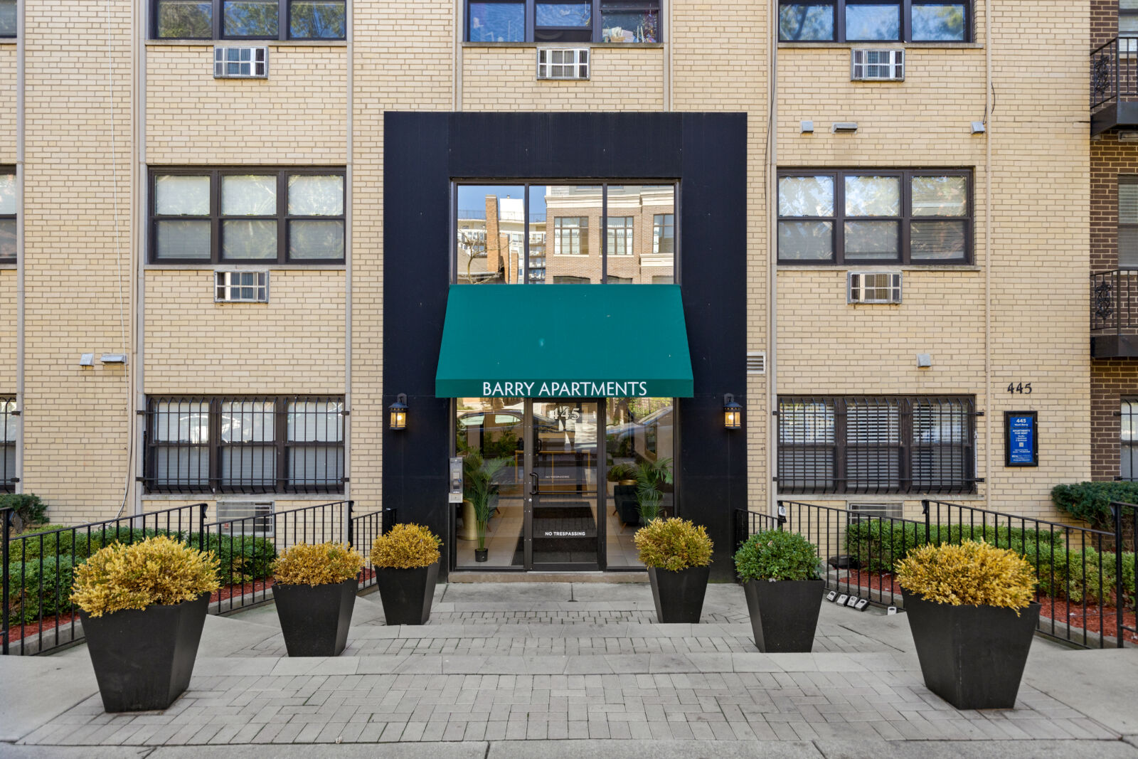 Front entrance of Barry Apartments at 445 W. Barry in Chicago’s Lakeview neighborhood, featuring ...