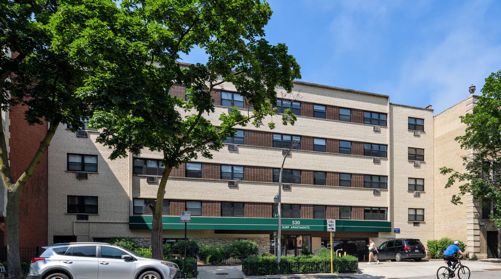 A mid-century light brick apartment building at 530 West Surf in Chicago’s Lakeview neighborhood....