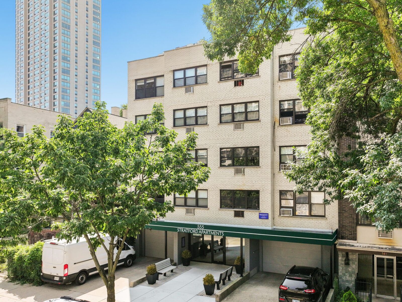 A five-story light brick apartment building at 555 W Stratford in Chicago’s Lakeview neighborhood...