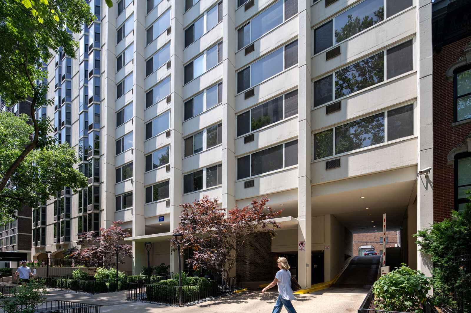 A full view of the multi-story brick apartment building at 1344 North Dearborn, with symmetrical ...