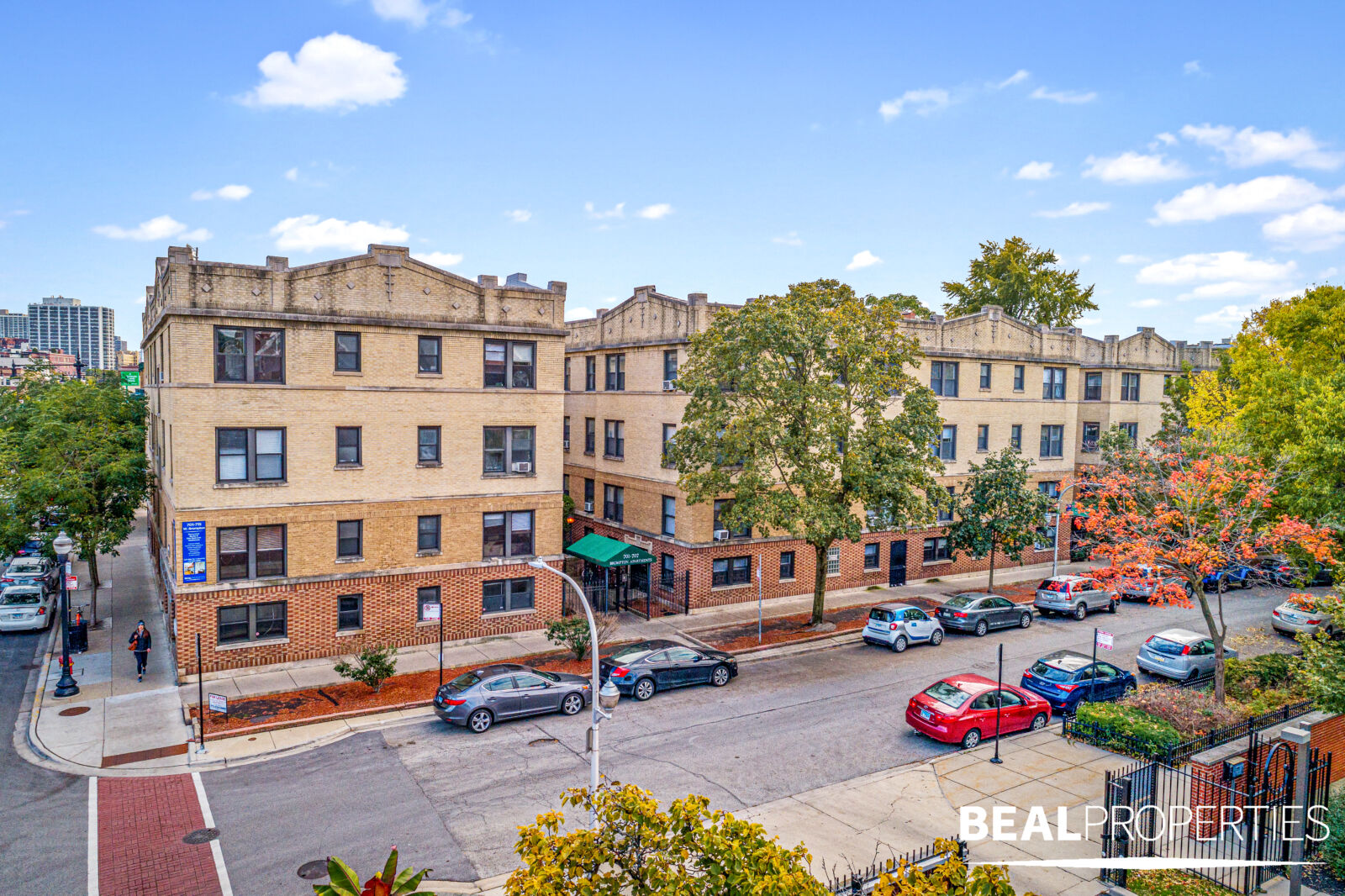 A four-story tan brick apartment building at 701–15 West Brompton in Chicago’s Wrigleyville neigh...