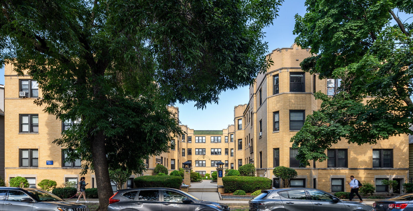 A yellow brick apartment building at 2317–2327 North Rockwell in Chicago’s Logan Square neighborh...