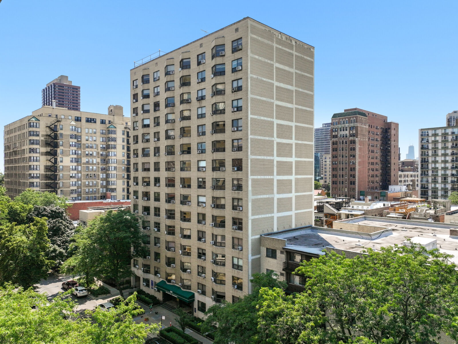 A high-rise beige brick apartment building at 445 West Wellington in Chicago’s Lakeview neighborh...