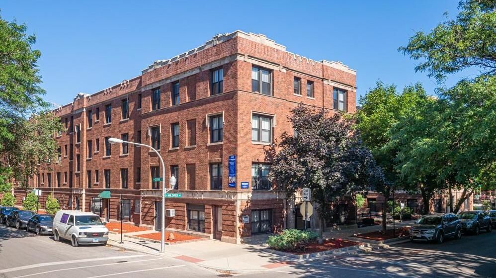 A classic three-story red brick apartment building at 2900–2914 North Mildred in Chicago’s Lakevi...