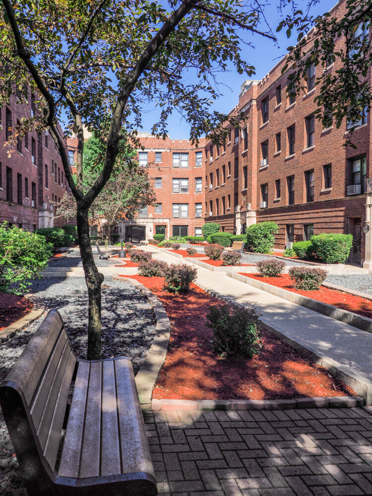A landscaped interior courtyard at 2900–2914 North Mildred in Chicago’s Lakeview neighborhood, fe...