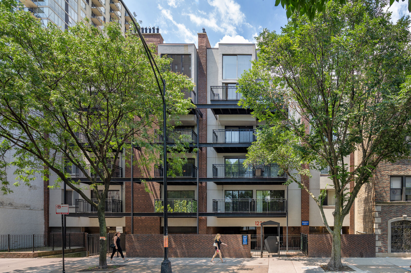 Street-level view of 1220 North LaSalle in Chicago’s Gold Coast neighborhood, a five-story red br...